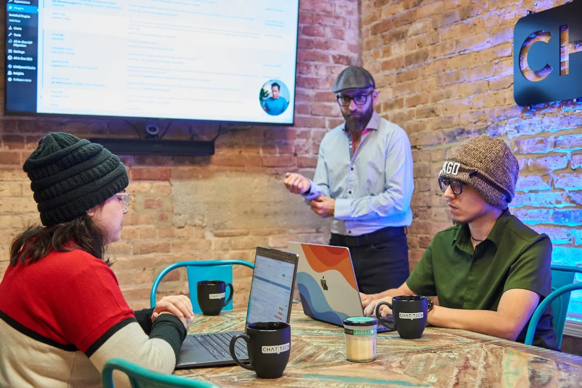 Burak and team discussing WordPress back end - Website Management
