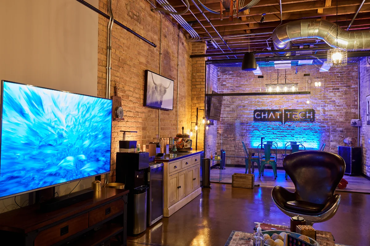 Wide shot of Chat Tech open plan offices meeting room and lounge